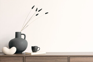 Creative minimalistic composition with white wall and stylish small personal accessories on wooden...