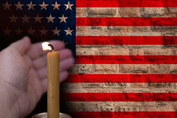 mourning candle burning front of flag USA, memory of heroes served country, grief over loss,...
