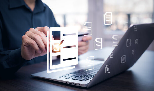 Businessman working on laptop with virtual screen. Online documentation database, IT consultant being set up Virtual Document Management System with a laptop, Software for archiving corporate files.