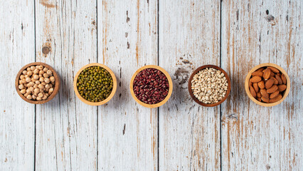 Mung beans, Red kidney beans, Chickpeas source and peeled barley in a basket wooden isolated on wood background