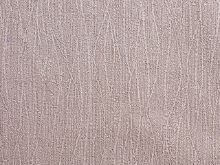 Abstract textured beige wallpaper background or backdrop with wavy texture patterns.