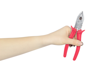 pliers in the hand, the hand holds out the pliers for working with electricity, isolated from the background	
