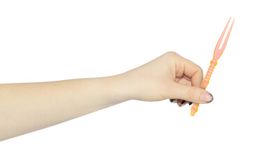 skewer for appetizer in hand, outstretched hand with plastic skewer for canapes isolated from background
