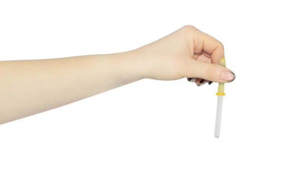 pipette in hand, outstretched hand with medical nose pipette isolated from background