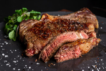sliced medium rare bone in rib eye steak 