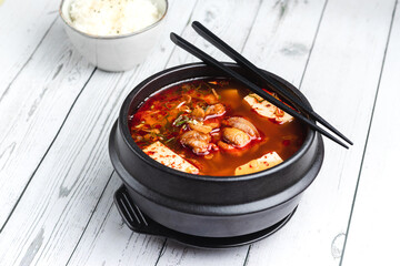 korean kimchi soup with tofu and pork belly