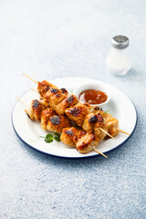 Homemade chicken skewers with mango chutney
