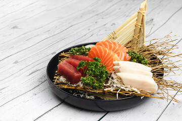 plate of japanese sashimi sushi of salmon, tuna and butterfish 