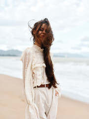 Summer Beauty: Young Woman, Relaxing on a Tropical Beach, Enjoying the Sun and Ocean Waves in Attractive Fashion