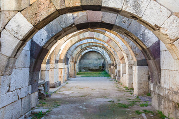 Fototapeta na wymiar Arch structure of North Stoa or Basilica at Roman Agora in ancient Smyrna. Izmir, Turkey