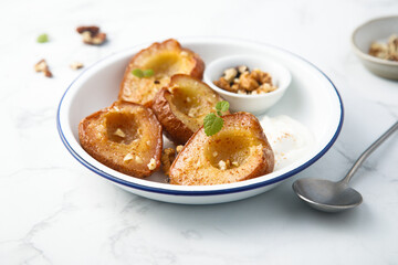 Roasted pears with walnut and yogurt