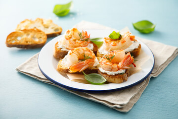 Shrimp crostini with cream cheese and herbs
