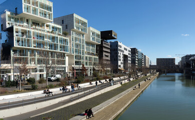 Wide angle panoramic view of Antoine Riboud quay in Confluence district on a sunny winter day,...