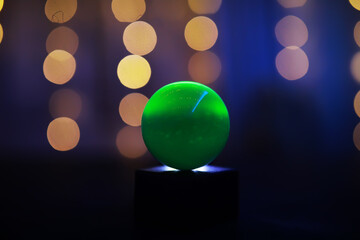 Background with glowing ball and bokeh. Ball for predictions. Clairvoyant ball.