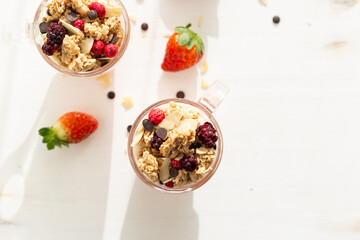 Yogurt with red fruit granola with strawberry cream, almonds and chocolate chips. Healthy snack...