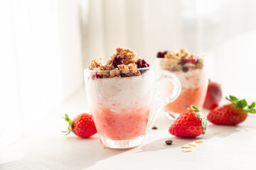 Yogurt with red fruit granola with strawberry cream, almonds and chocolate chips. Healthy snack idea for children.