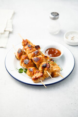 Homemade chicken skewers with mango chutney
