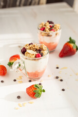 Yogurt with red fruit granola with strawberry cream, almonds and chocolate chips. Healthy snack idea for children.