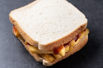 Sliced white bread on black slate background. Close up