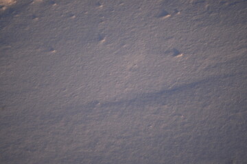 frozen asphalt as a backdrop, snow and ice on the road not cleared, icy conditions 