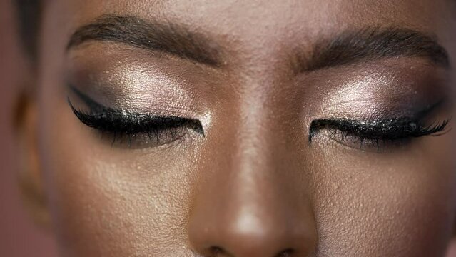 Close-up on eyes with sexy make-up with brown eyebrows