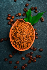 Instant coffee in a wooden bowl. Coffee background. Free space for text.