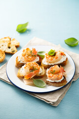 Shrimp crostini with cream cheese and herbs