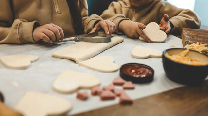 Fototapeta na wymiar Children making pizza in the kitchen