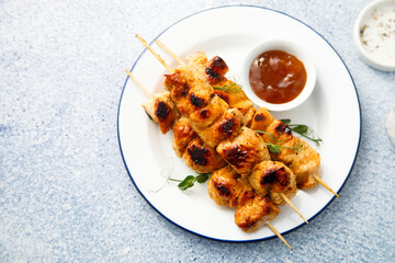 Homemade chicken skewers with mango chutney