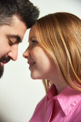 Close up photo of man and woman, wife and husband lovely looking to each other against white background. Romantic in relationship. Concept of love, Valentine Day, togetherness. Ad
