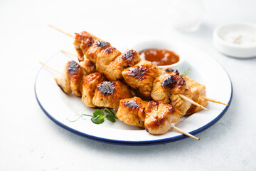 Homemade chicken skewers with mango chutney