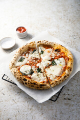 Traditional homemade pizza with tomato sauce and cheese	