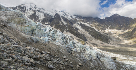 Panorama of a large icefall in a mountainous area.