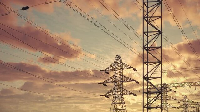 A seamless loop of electrical pylons towers silhouetted against a dramatic sunrise, showcasing the intersection of nature and technology. Ultra HD 4K 3840x2160.