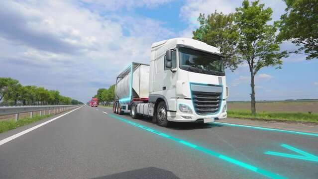 A smart truck delivers goods. Delivery of goods with a smart truck. Smart self-driving truck on the highway.