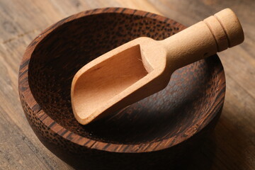 wooden spoon in a coconut tree wooden bowl. 