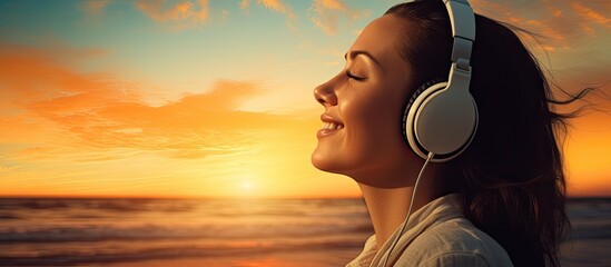 Inspired happy serene female with closed eyes enjoying of listening calm music with beautiful view at sunset time Relief stress and healthy minds. Creative Banner. Copyspace image - obrazy, fototapety, plakaty