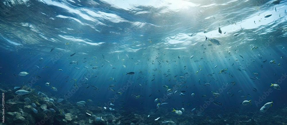 Poster garbage plastic bottle floats in blue sea water with underwater pollution of the environment and oce