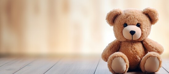 Girl with teddy bear lying on wooden floor at home. Creative Banner. Copyspace image