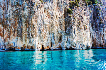 The rockface of the steep and chalky cliff. Cilento coastline, Italy.