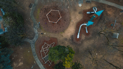 Drone view of a city park and playground in winter. January 20, 2024 Italia, Milano, San Donato Milanese