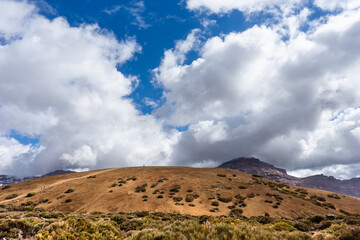 Hills and white clouds in a blue sky. Tenerife, Canary Islands, Spain. - 722925033