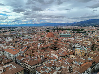 City architecture in aerial view with Dome of the Medici chapel, Santa Maria Novella basilica and station, Florence ITALY
