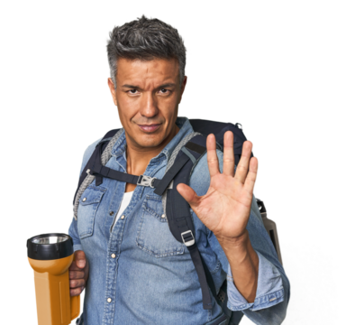 Hispanic trekker with backpack and flashlight smiling cheerful showing number five with fingers.