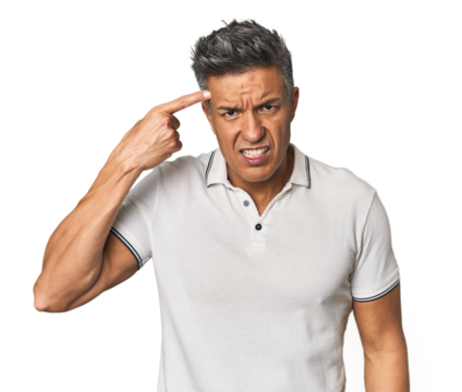 Middle-aged Latino man showing a disappointment gesture with forefinger.