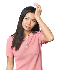 Young Chinese woman in studio setting tired and very sleepy keeping hand on head.