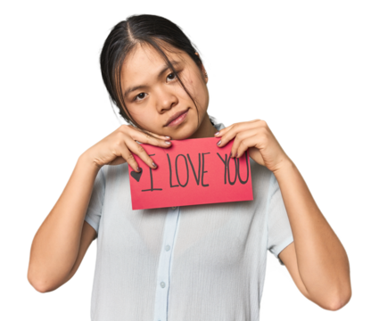 Young Chinese woman with "I love you" sign in studio