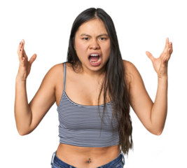 Young Chinese woman in gray top, studio screaming with rage.
