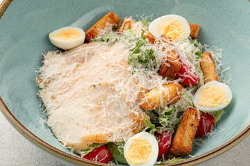 Portion of gourmet caesar salad with chicken
