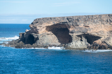 West coast of Fuerteventura island. View on blue water and black caves of Ajuy village, Canary islands, Spain.